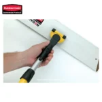 Image of a person using a yellow and black handheld tool to cut a white panel, with Beyond Hygiene branding in the background, emphasizing professional cleaning and hygiene equipment.