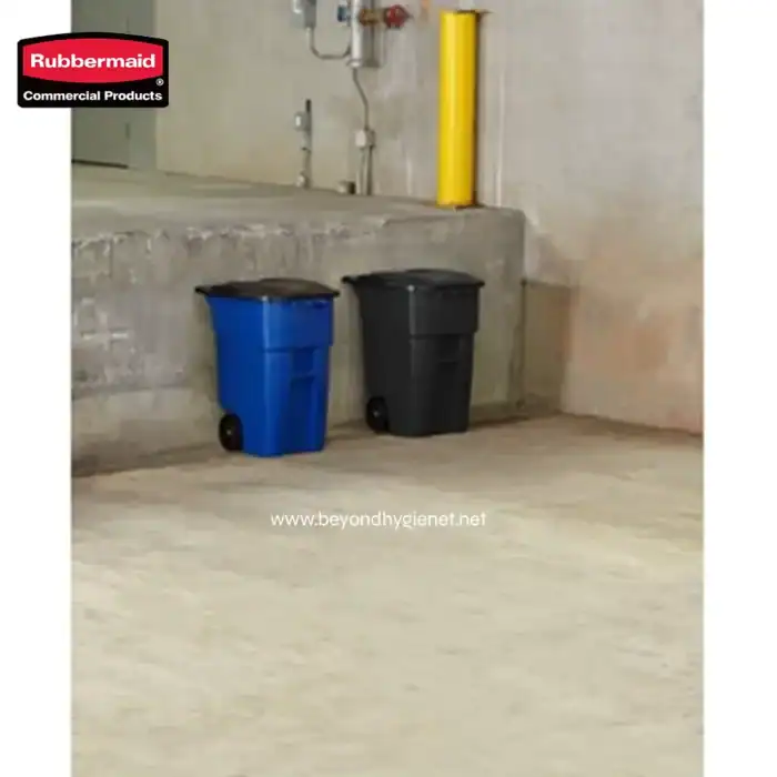 Blue and black wheeled trash bins in an industrial setting, suitable for commercial waste management and hygiene solutions at Beyond Hygiene Asia.