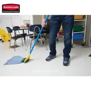 Rubbermaid commercial cleaning mop and cleaning supplies in an office setting; professional hygiene maintenance equipment for commercial cleaning services.