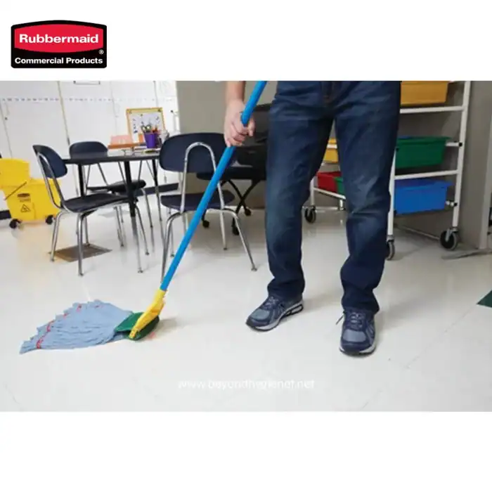 Rubbermaid commercial cleaning mop and cleaning supplies in an office setting; professional hygiene maintenance equipment for commercial cleaning services.