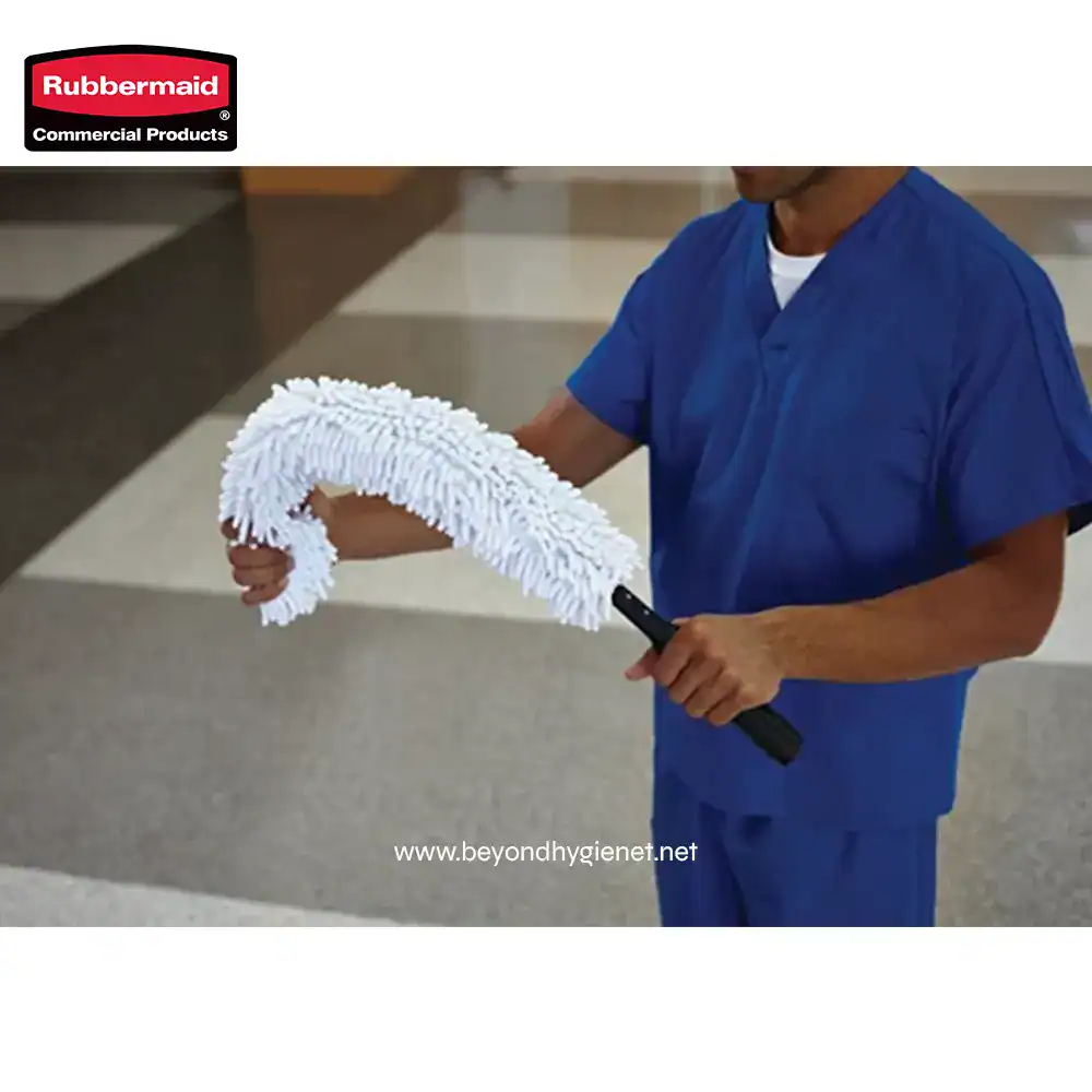 2 Microfiber dust mop being used by a janitor for cleaning floors, showcasing effective cleaning tools for commercial and industrial sanitation.