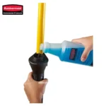 Rubbermaid cleaning product being poured into a mop bucket for sanitation and hygiene purposes in Asia.