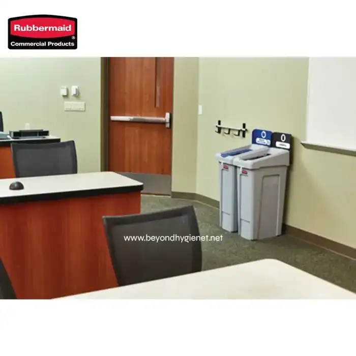 Rubbermaid commercial paper towel and hand dryer dispensers in an office environment.