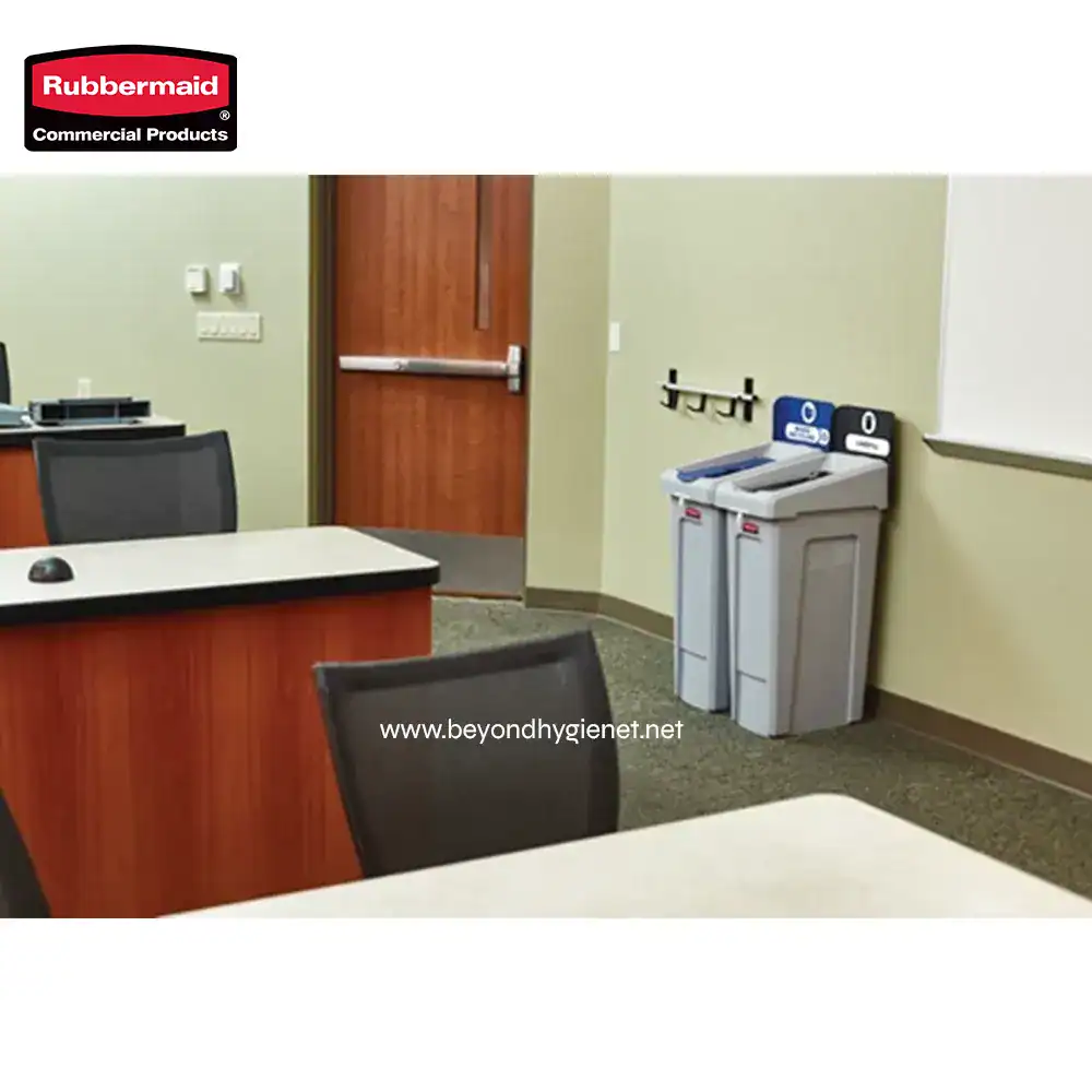 3 Rubbermaid commercial paper towel and hand dryer dispensers in an office environment.