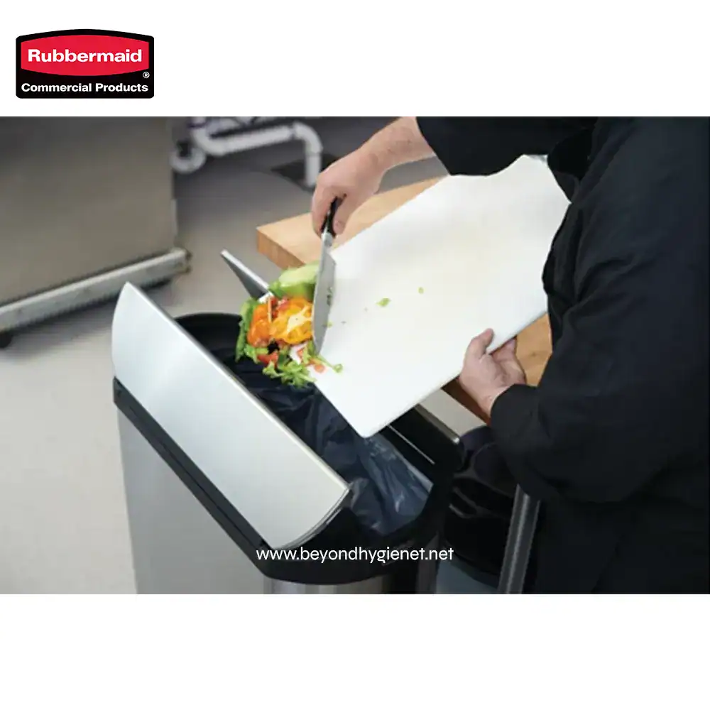 3 Fresh salad being discarded into a Rubbermaid commercial trash bin, highlighting hygiene and waste management practices for food venues.