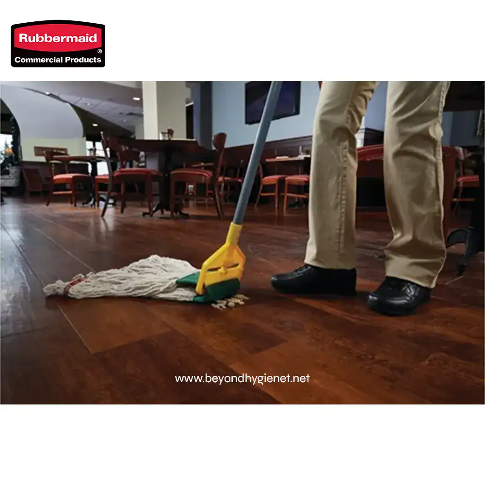 4 Vacuum cleaning in a restaurant or dining area with wooden flooring for commercial cleanliness and hygiene.