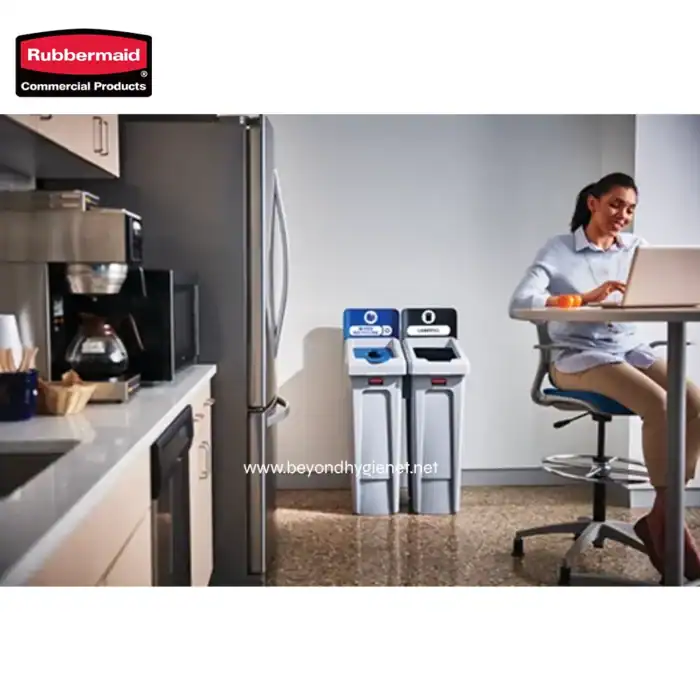 Rubbermaid commercial hand sanitizer dispensers and paper towel stations in an office break room, promoting hygiene and sanitation.