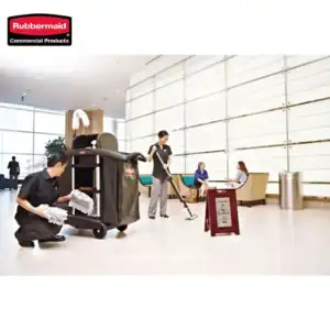 Restroom cleaning crew disinfecting airport lobby with microfiber mops and cleaning equipment, ensuring hygiene standards are met in public spaces.