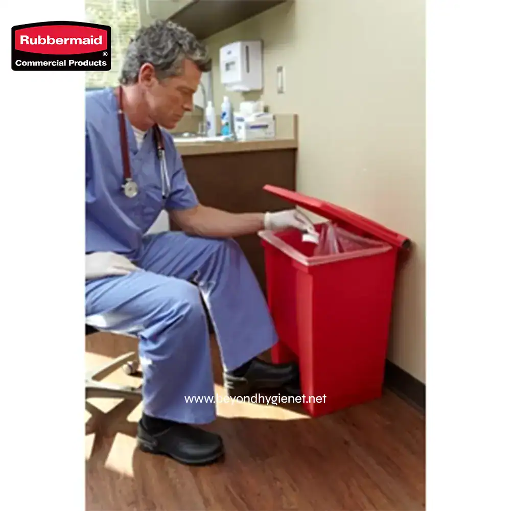 5 Red medical waste disposal bin in a healthcare setting, used for proper disposal of sharps and contaminated materials to maintain hygiene and safety.