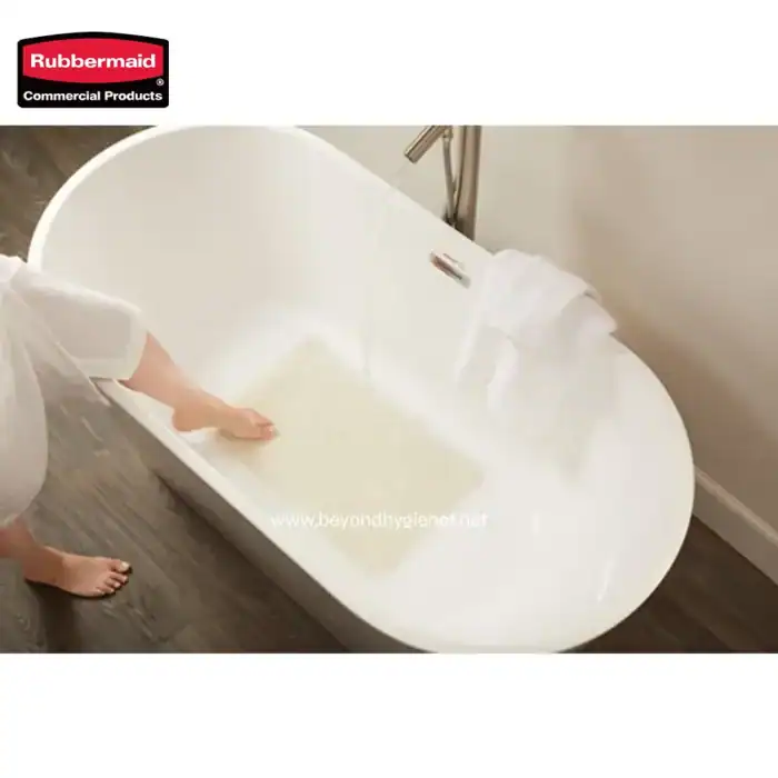Rubbermaid commercial bath products, featuring a luxurious soaking bathtub with clean, white towels for an optimal hygiene and relaxation experience.