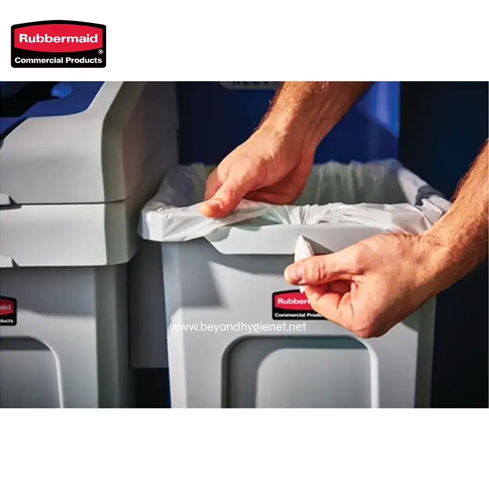 5 Rubbermaid commercial trash waste bin with hands changing trash bag for sanitation and waste management. industrial trash container used in hygiene and cleaning solutions.