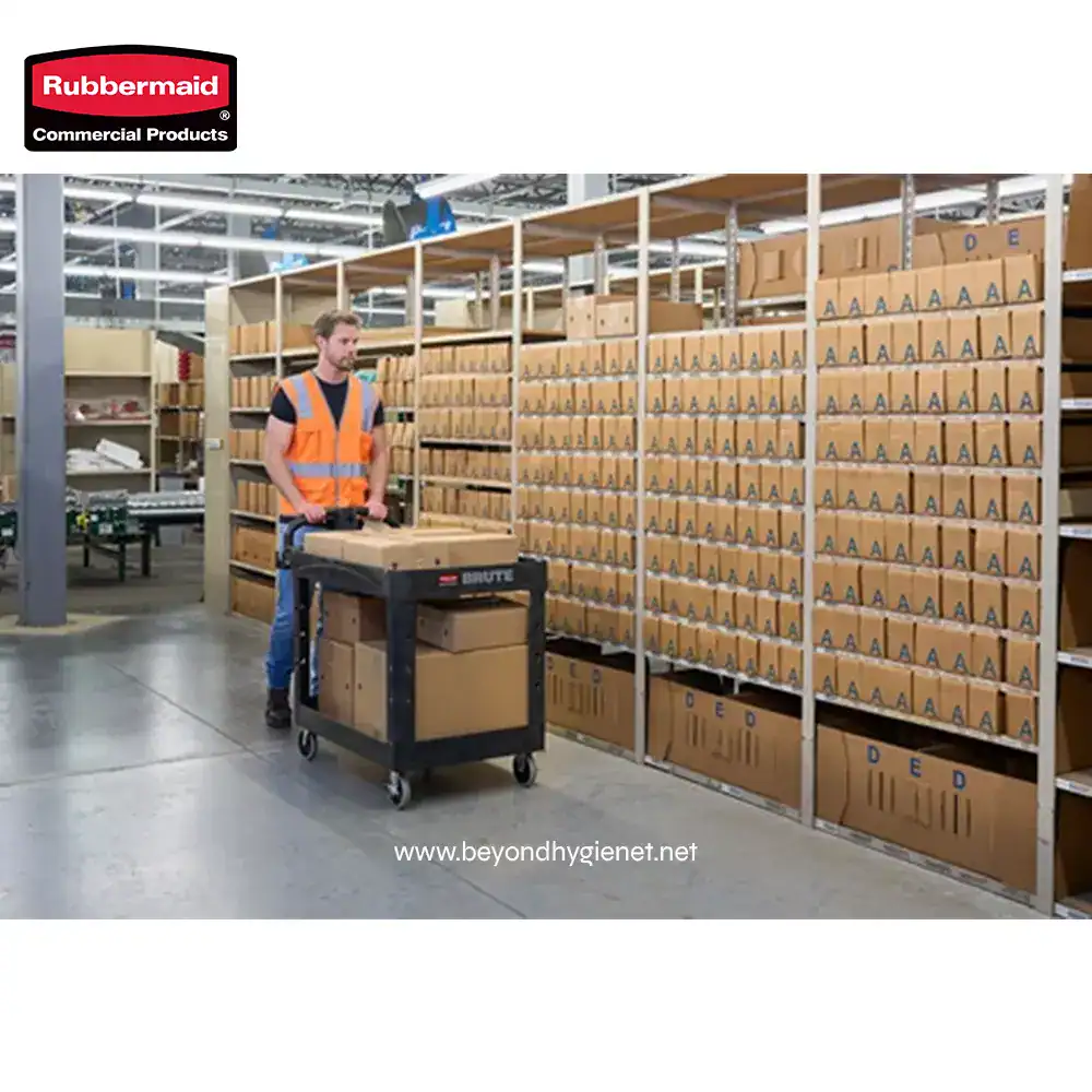 6 Bright warehouse worker in safety vest organizing parcels on a trolley amidst neatly stacked cardboard boxes, emphasizing efficient logistics and inventory management for hygiene and sanitation supplies.