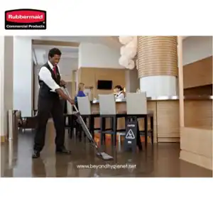 Rubbermaid toilet brush with holder for bathroom cleaning and hygiene maintenance.
