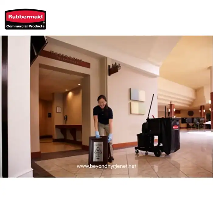 Disinfecting hotel lobby area with professional cleaning supplies and sinks, emphasizing hygiene and sanitation services for hospitality and commercial spaces.