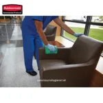 Disinfecting office chair with cleaning cloth and gloves for hygiene and sanitation cleaning services in Asia.