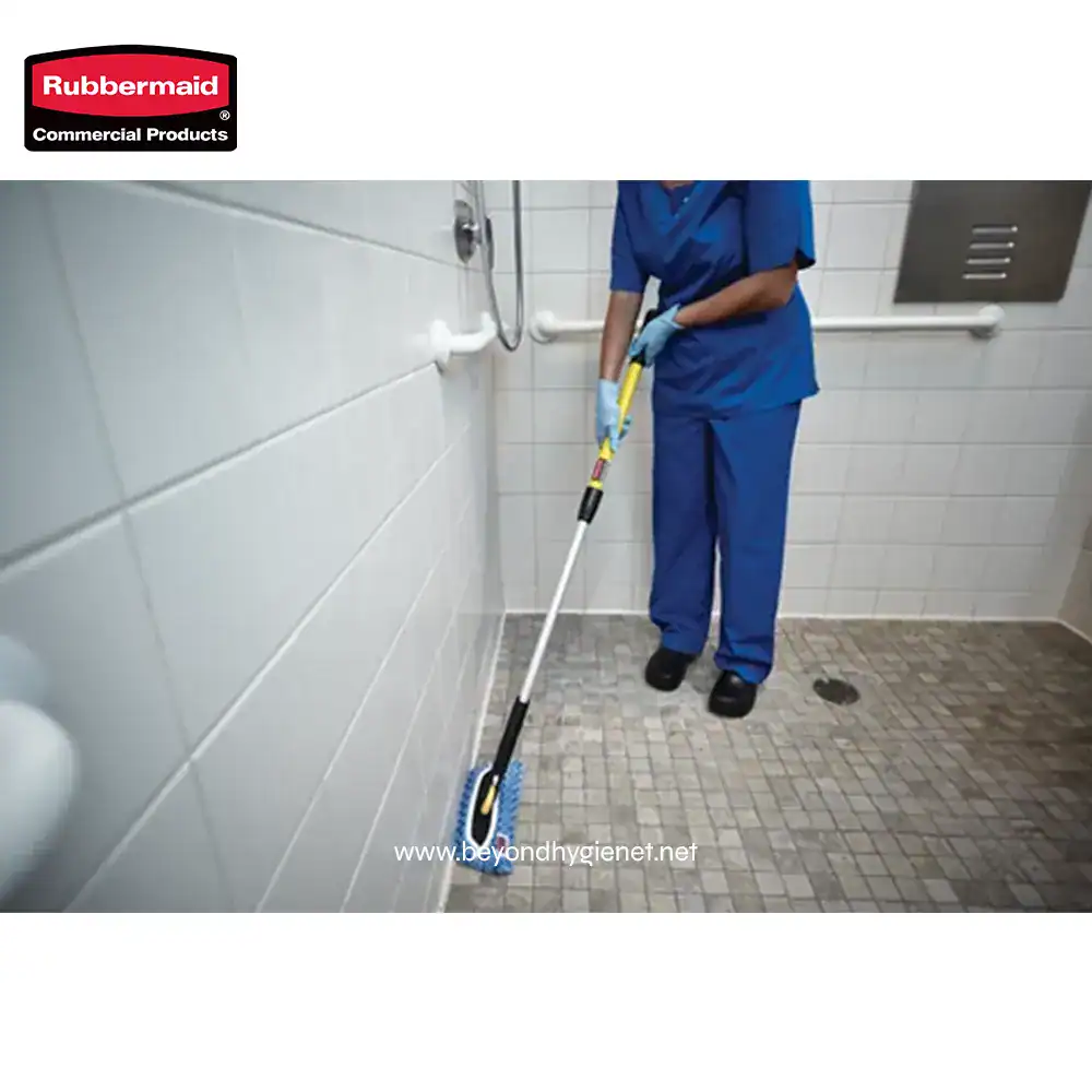 6 Mop and scrub brush cleaning bathroom floor in a commercial restroom, professional janitorial service, hygiene and sanitation cleaning, Beyond Hygiene Asia, Rubbermaid cleaning tools, sanitary restroom maintenance.