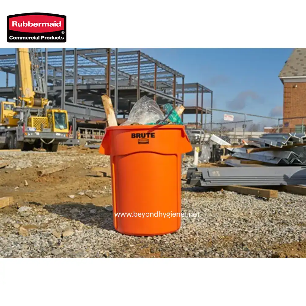 6 Rubbermaid commercial orange waste bin on construction site for waste disposal and hygiene.