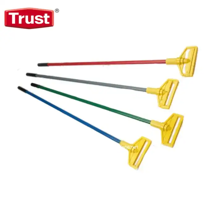 Cleaning tools with yellow handles and colored rods (red, gray, green, blue) used for maintenance and sanitation purposes.