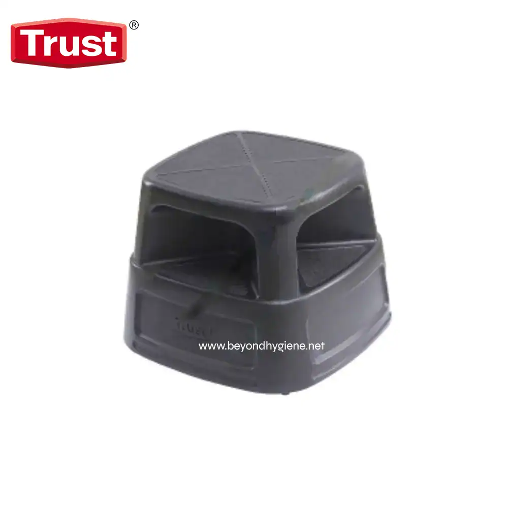 6930 Retractable step stool for hygiene and sanitation facilities, durable plastic, black color, compact design, suitable for commercial and industrial cleaning environments.
