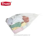 Clothes packed in a white mesh laundry bag for laundry hygiene, hygiene and garment storage.