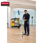Efficient cleaning staff using a flat mop in a modern office environment, showcasing professional hygiene and floor cleaning services provided by Beyond Hygiene Asia.