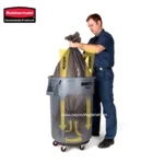 Rubbermaid commercial waste bin with a collection of trash inside for industrial cleaning and sanitation solutions.
