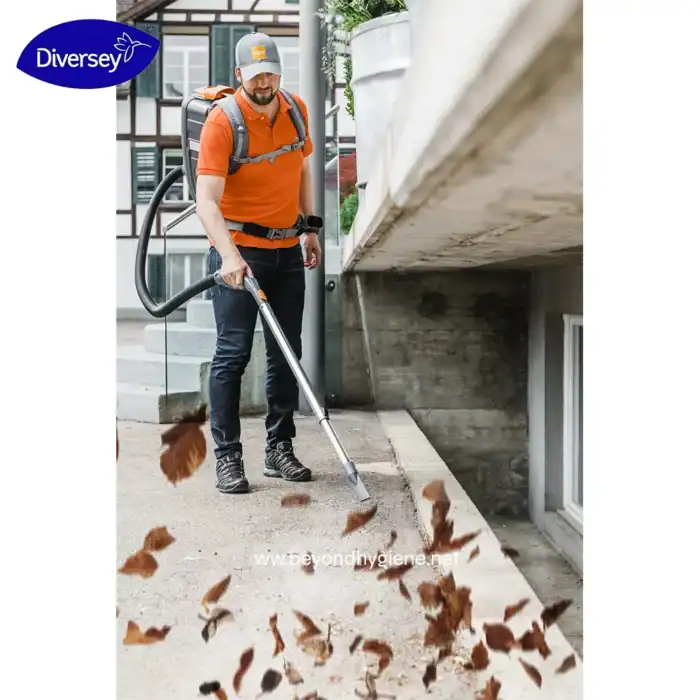 Blower vacuum cleaner used for outdoor leaf and debris removal in commercial or residential settings.