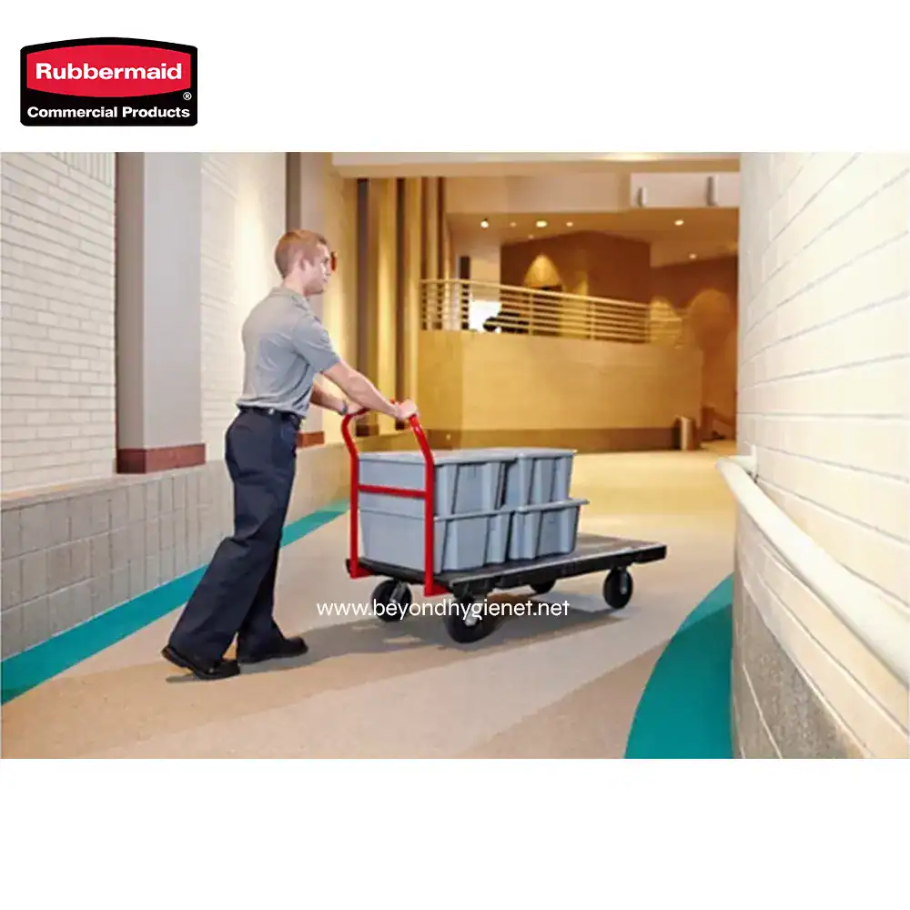 HEAVY DUTY PLATFORM TRUCK, 24 X 48 WITH 8 TPR CASTERS (7) Rubbermaid commercial cleaning cart with cleaning supplies, indoor hallway setting, professional janitor, organized sanitation equipment, hygiene maintenance in commercial cleaning.
