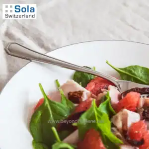 Fresh salad with spinach, strawberries, and chicken on a white plate, highlighting clean eating and healthy food options, suitable for hygiene and wellness themes at Beyond Hygiene Asia.