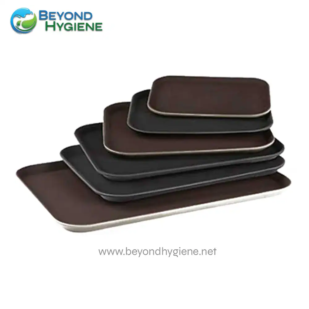 RECTANGULAR NON-SLIP TRAY Non-slip black and brown rectangular serving trays for food presentation, durable and easy to clean, ideal for commercial and home use, by Beyond Hygiene Asia.