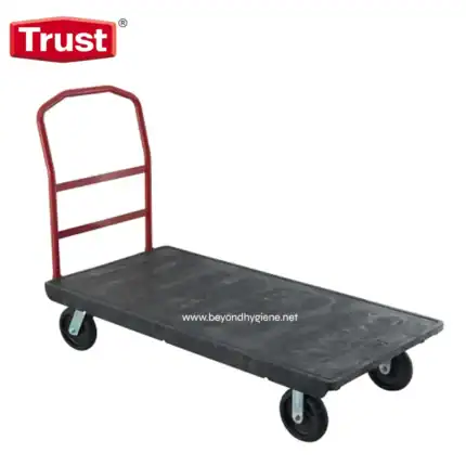 - Heavy-duty industrial flatbed cart with red frame and rubber wheels, ideal for warehouse logistics and material handling in commercial cleaning and hygiene environments.