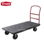 Heavy-duty flatbed trolley with red handle, durable black platform, ideal for warehouse, industrial, and commercial use, supporting heavy loads and facilitating efficient material handling.