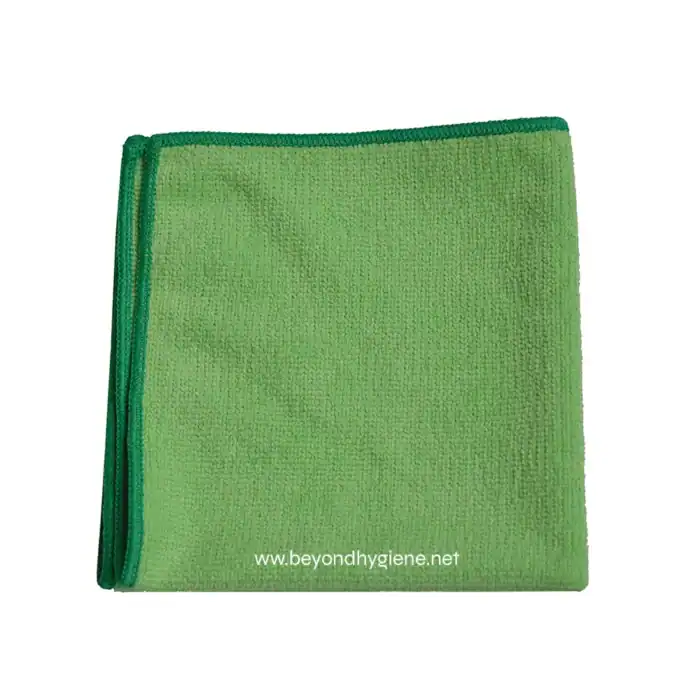 Disposable cleaning cloth, microfiber green cleaning towel for hygiene, sanitation, and wiping surfaces, essential for janitorial and cleaning services in Asia.