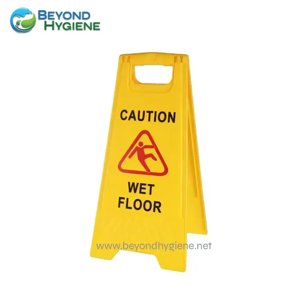UGA 042 Caution wet floor sign for safety, highlighting slip hazards in commercial and public spaces to promote hygiene and prevent accidents.