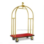 Luggage cart with gold frame and red base for hotel or hospitality industry cleaning and guest service.