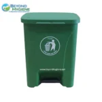 Green waste bin for hygiene waste disposal with Beyond Hygiene branding and instructional icon.