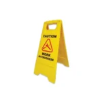 Caution work in progress yellow portable safety sign, warning of ongoing maintenance or construction, ideal for hygiene and safety management in Asia.