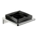 Black ceramic soap dish on a stainless steel holder, modern bathroom accessory, used for holding soap, sleek design perfect for upscale hygiene and sanitation solutions.