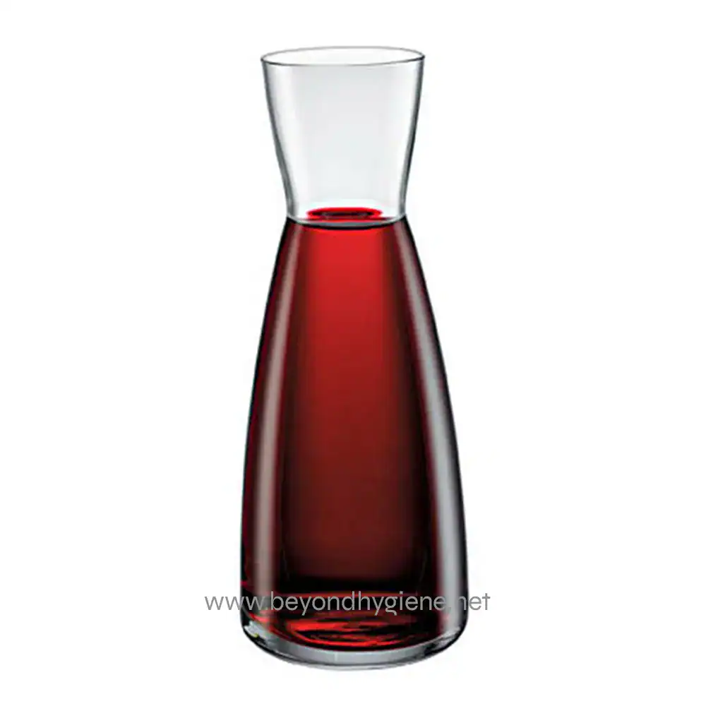 016-25001-1 Clear glass carafe filled with red liquid, modern tableware, contemporary design, beverage serving, stylish drink presentation.