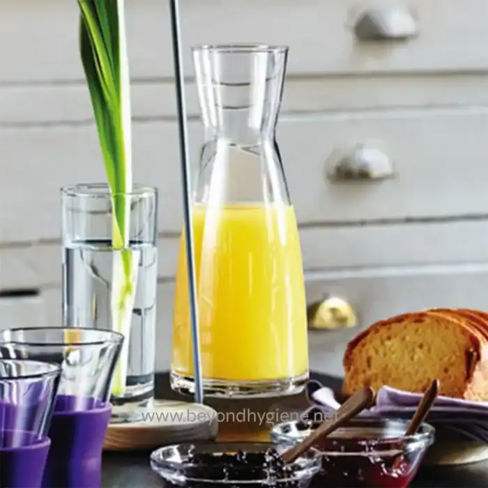 Clear glass with lemonade, fresh fruit juice, and herbs in a modern setting, emphasizing hygiene and cleanliness for Asian markets.