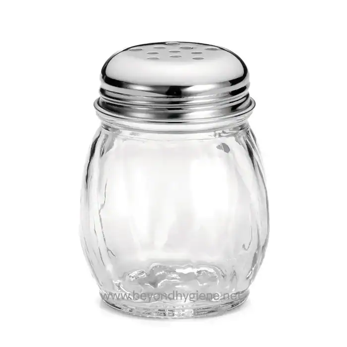Clear glass salt shaker with metal top, used for seasoning food in commercial and restaurant settings. Durable, hygienic, and easy to refill, ideal for maintaining cleanliness and hygiene standards.