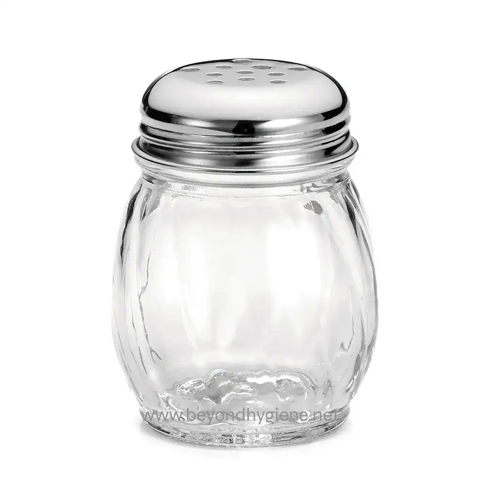 1 Clear glass salt shaker with metal top, used for seasoning food in commercial and restaurant settings. Durable, hygienic, and easy to refill, ideal for maintaining cleanliness and hygiene standards.