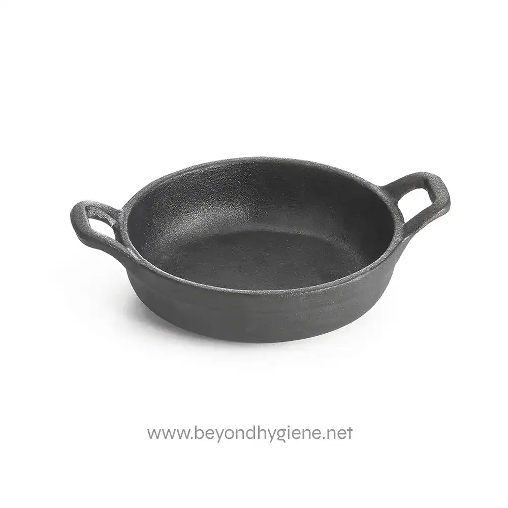 Cast iron skillet, durable black cookware, versatile kitchen pan for frying, searing, and baking, perfect for professional and home kitchens, from Beyond Hygiene Asia.