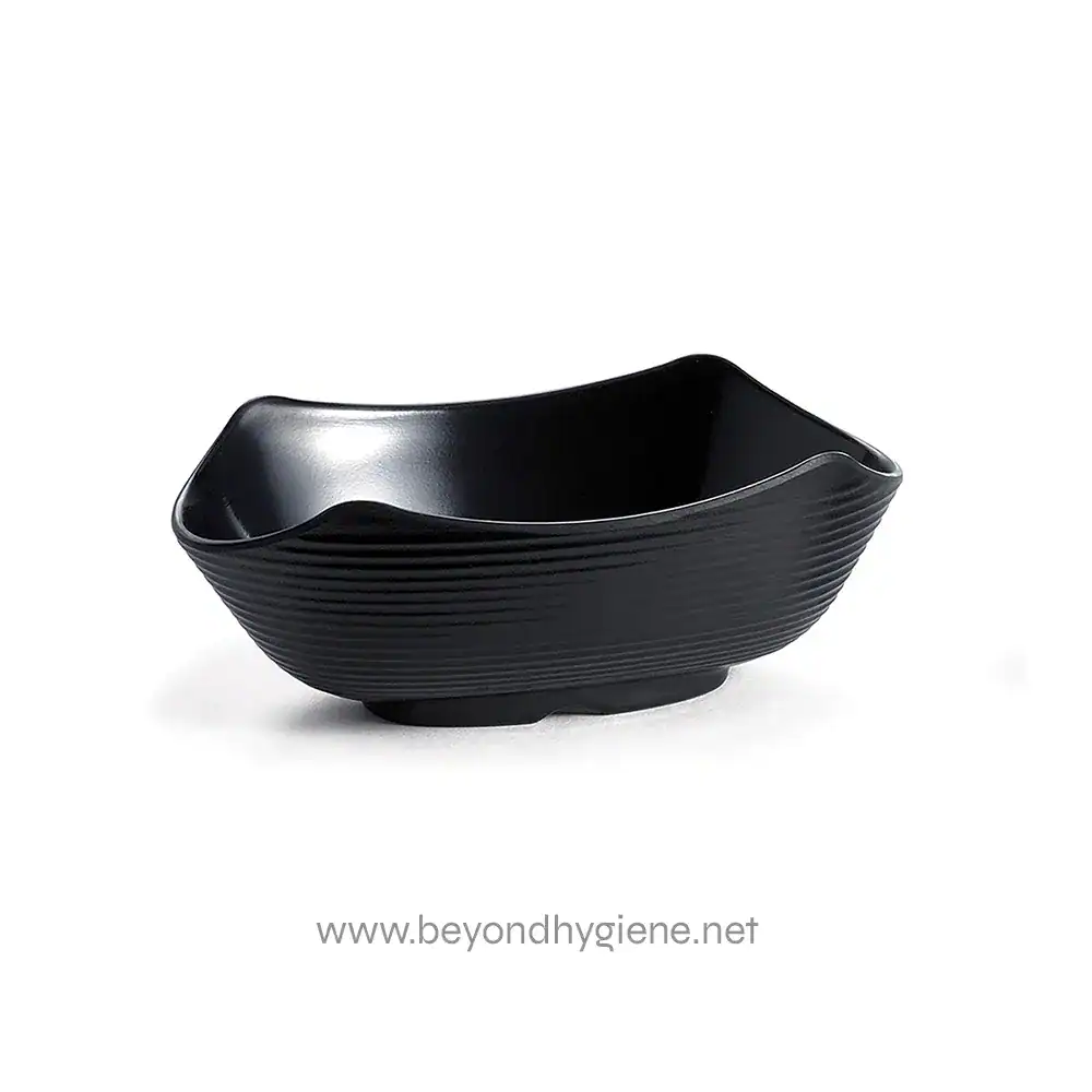 Black ceramic soap dish for bathroom or kitchen decor, featuring a modern textured design and a sleek, curved shape for organizing soap bars efficiently.