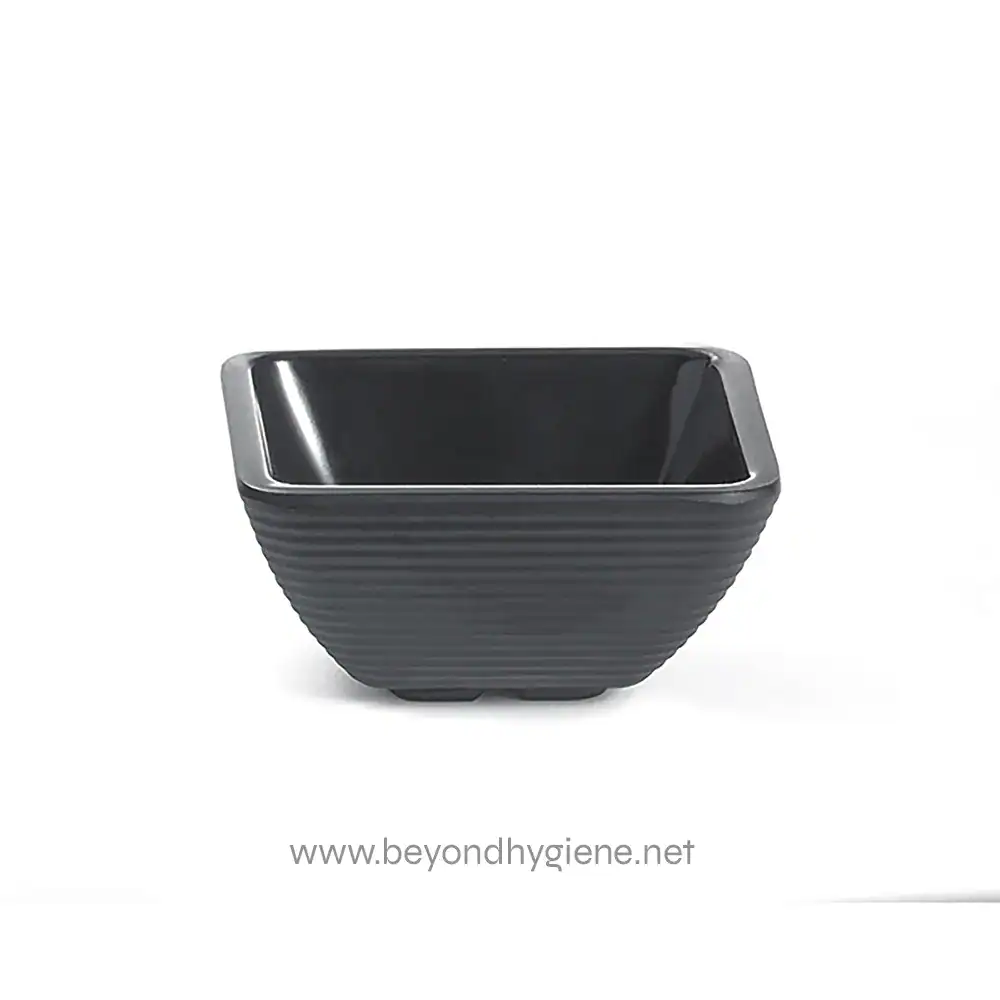 Black ceramic or porcelain countertop or table bowl, modern design, used for food presentation or decorative purposes. Perfect for stylish kitchens, restaurants, and home decor.