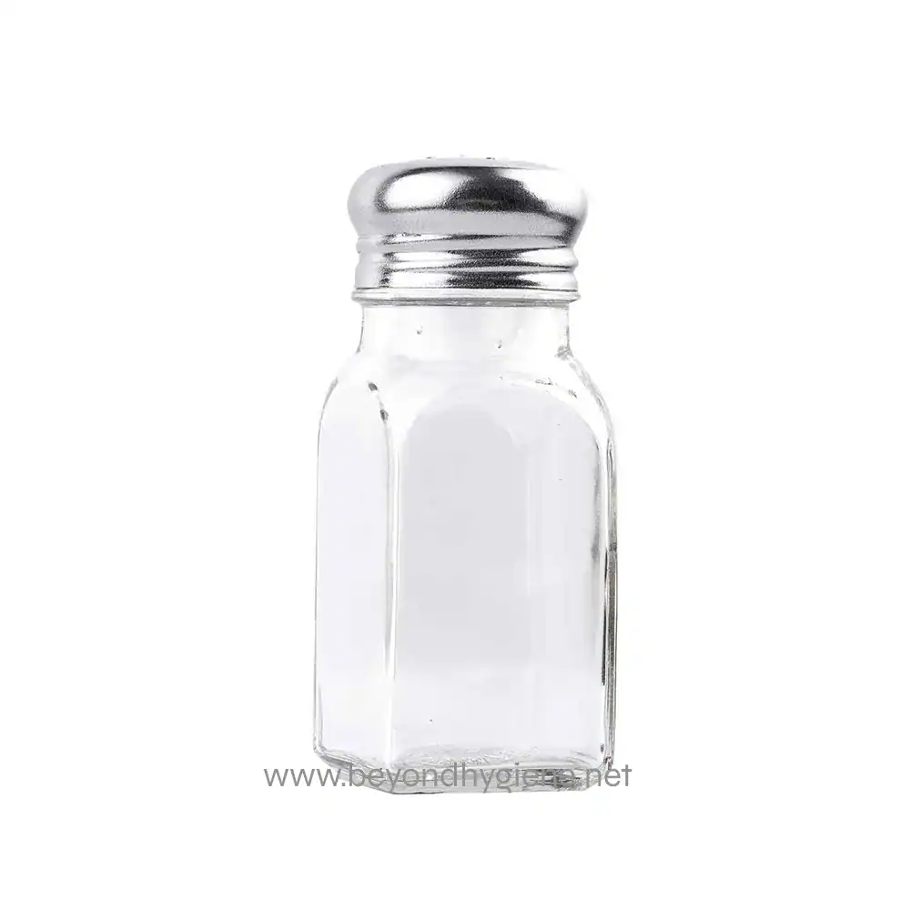 Salt shaker empty clear glass container with metal lid, used for seasoning food in dining settings. Perfect for restaurants and hospitality hygiene standards.