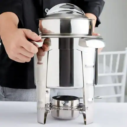 Stainless steel food warmer or chafing dish used for catering, catering equipment, express catering, or buffet service.