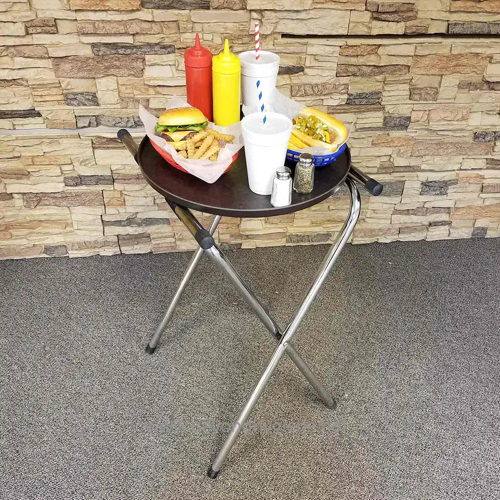 11 Kitchen table with fast food including burger and fries, condiments, and beverages, in a casual restaurant setting.