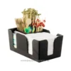 Disposable wooden stir sticks and toothpicks in a black organizer, ideal for hygiene and food service establishments in Asia, promoting eco-friendly and sanitary practices.