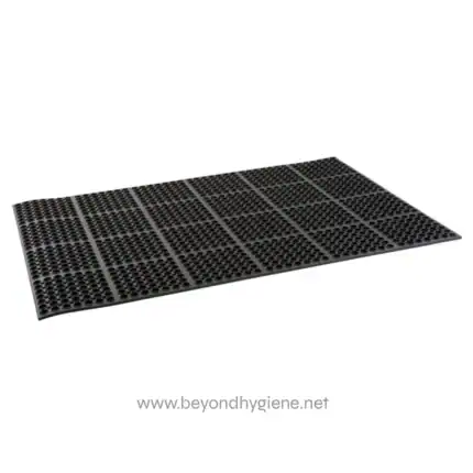 Rubber entrance mat with non-slip design for hygiene and safety | Beyond Hygiene Asia logo on black anti-fatigue floor mat for commercial use.